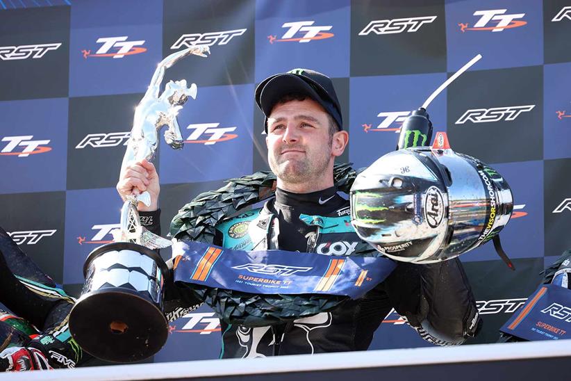 Michael Dunlop (Hawk Racing Honda) celebrates after winning the Superbike TT in the Isle of Man. (Pacemaker Press / Stephen Davison)