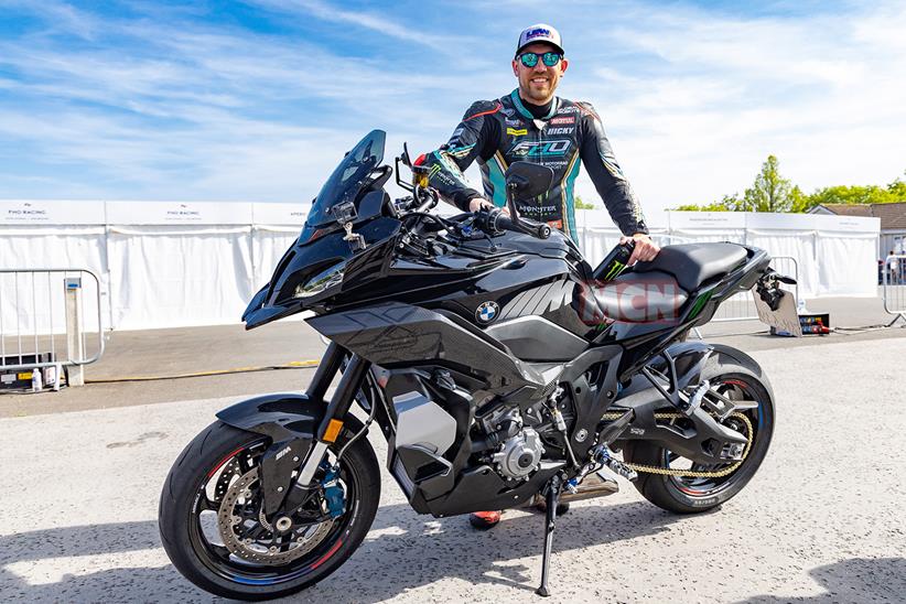 Peter Hickman poses with the BMW M1000XR test bike