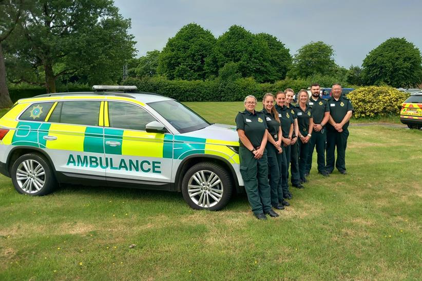 Ambulance crews standing together