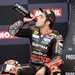 Danilo Petrucci sips champagne after podiuming at Donington Park