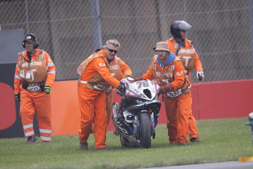 Loris Baz's BMW is wheeled away after his crash at Donington Park