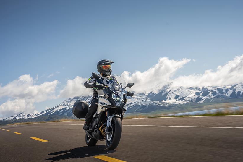 A CFMoto 700MT being ridden on the road