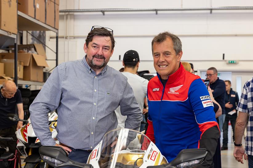 John McGuinness poses with customers