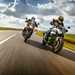 Two motorcyclists riding on the road