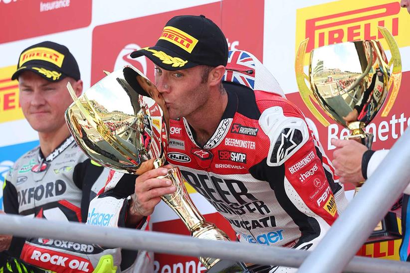 Tommy Bridewell celebrates victory at Brands Hatch on the podium