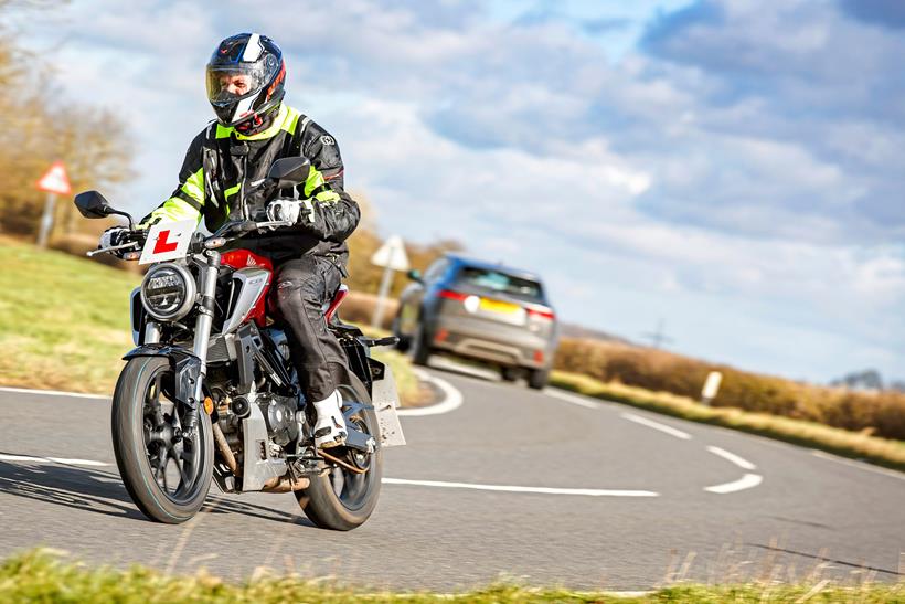 Riding a Honda CB125 on the road in the UK