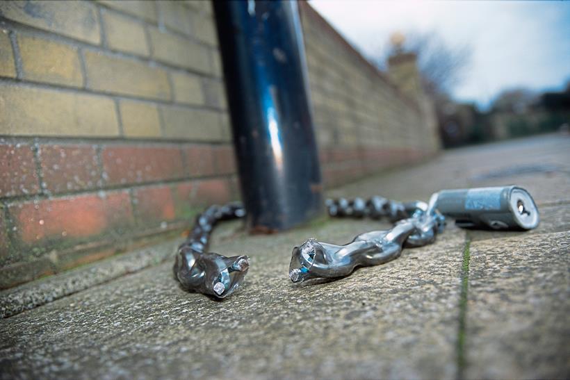 A compromised cycle chain around a lamp post