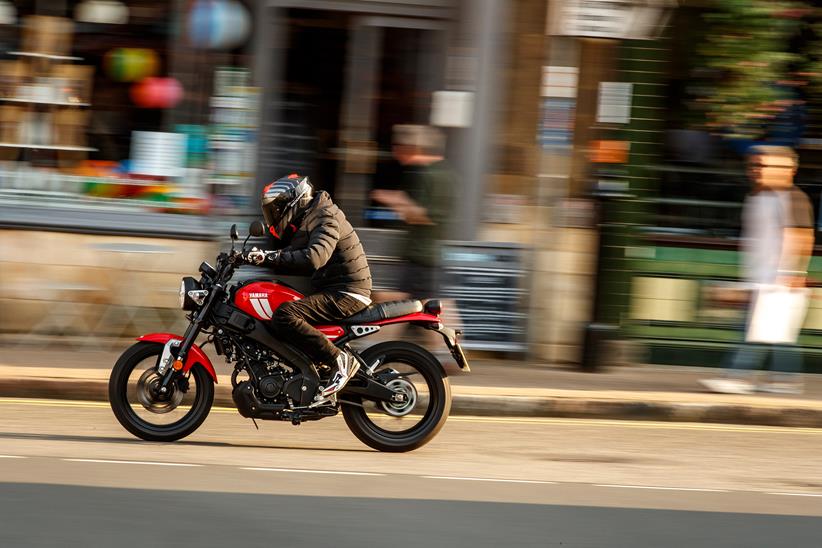 Yamaha XSR125 with pedestrian in background