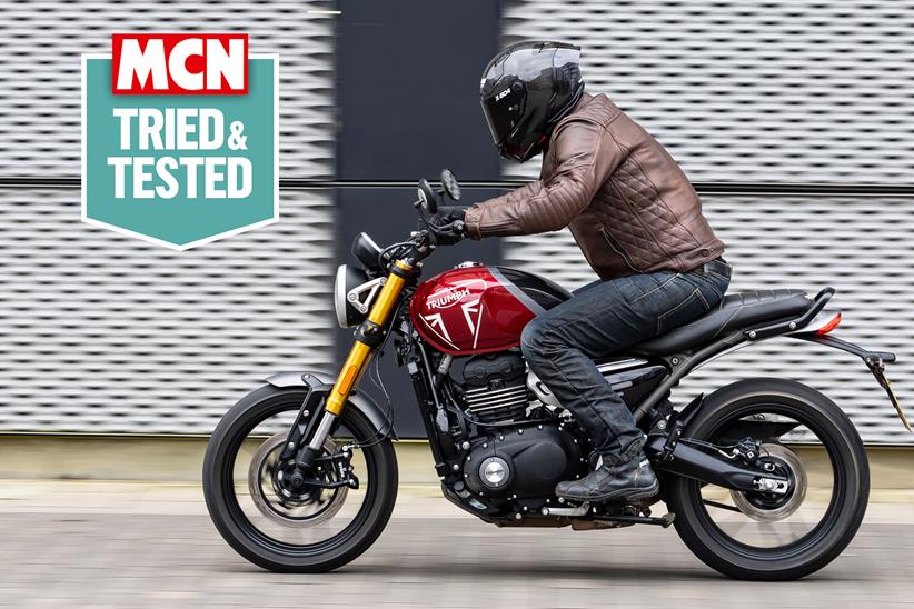 Rider wearing jeans on a triumph motorcycle