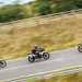 Three riders on road