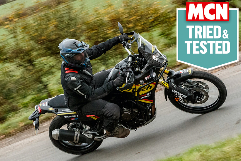 Riding a motorcycle wearing a laminated textile jacket, with MCN's Tried & Tested logo