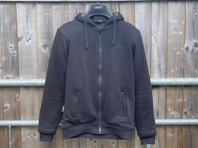  RST X Kevlar hoodie hanging on fence