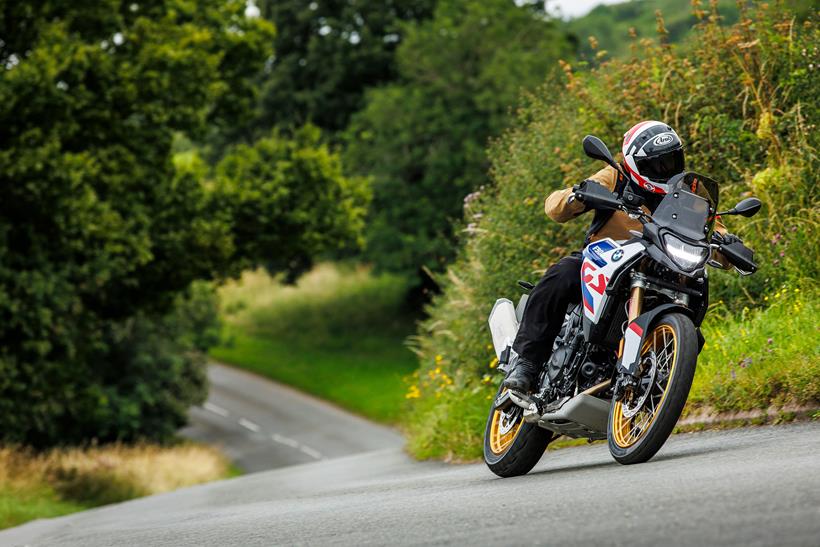 Motorcycle rider on a BMW bike wearing a textile suit