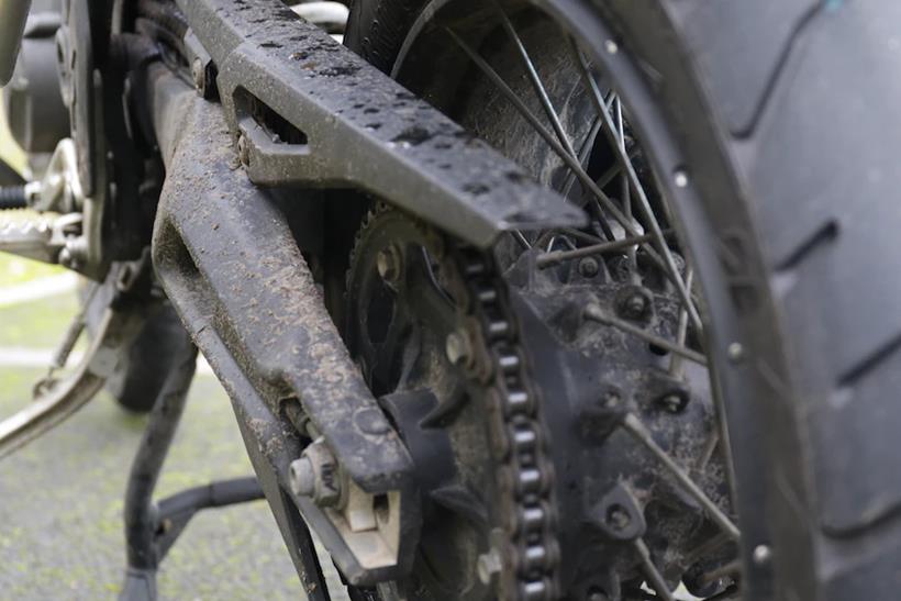 The dirty chain of the motorcycle