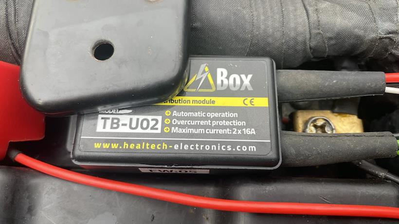 Healtech Thunderbox tucked away near motorcycle battery