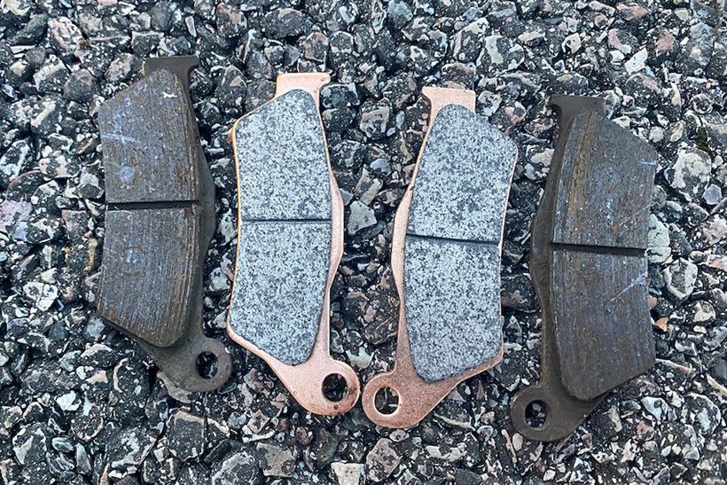 Ferodo HH sintered brake pads next to original equipment items