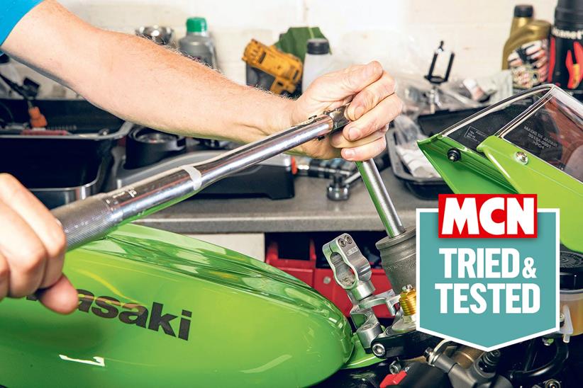 Torque wrench being use d on a Kawasaki motorcycle