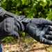 Woman pulling on motorcycle gloves