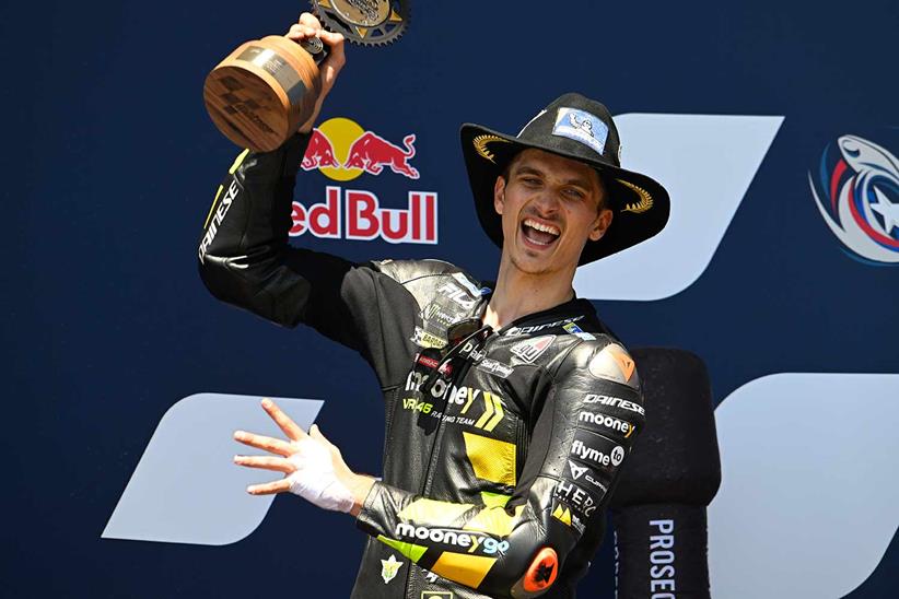 Luca Marini celebrates on the podium at COTA