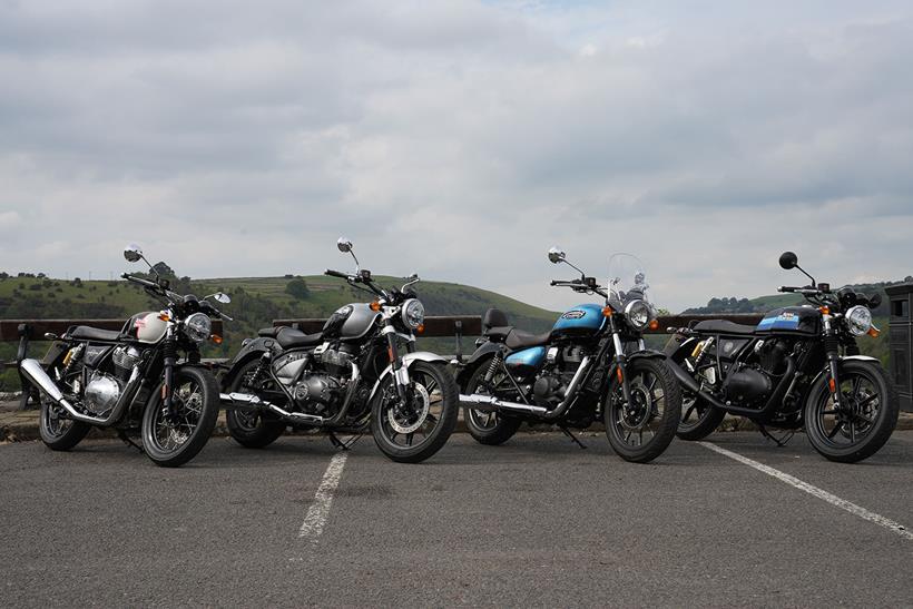 Four Royal Enfield motorcycles parked together