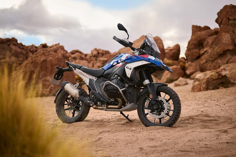 A BMW R1300GS parked on sand