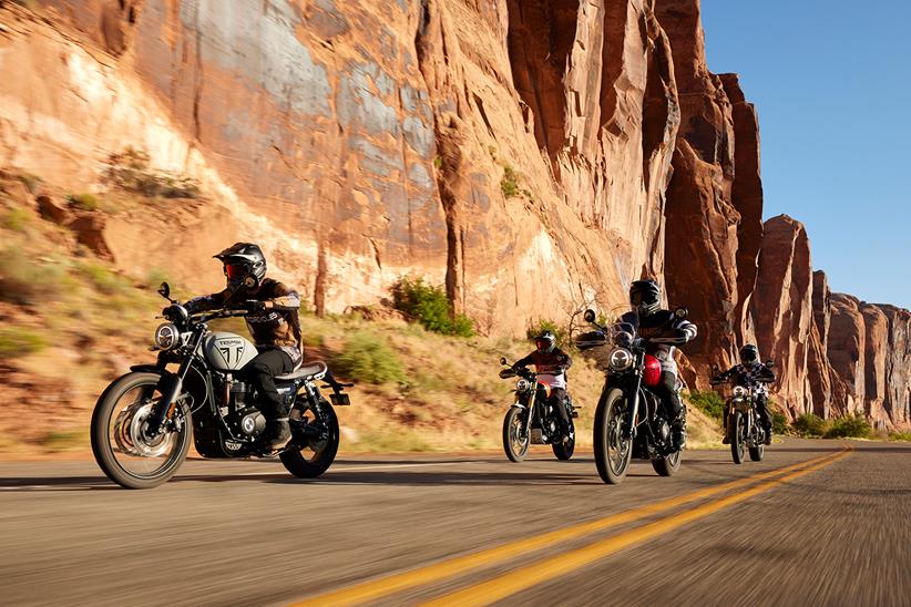 A group of Triumph Scrambler 1200s being ridden together