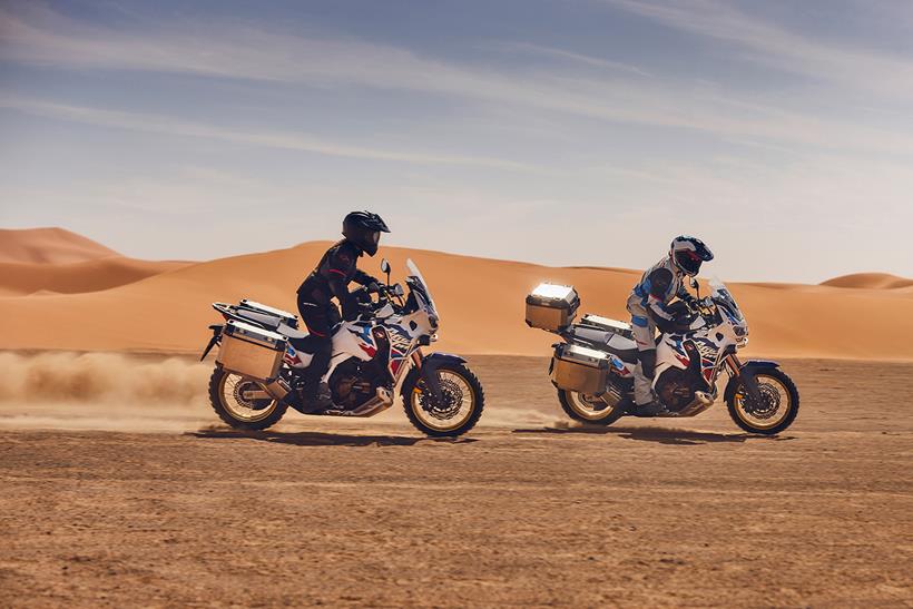 A pair of Honda Africa Twin Adventure Sports being ridden off-road