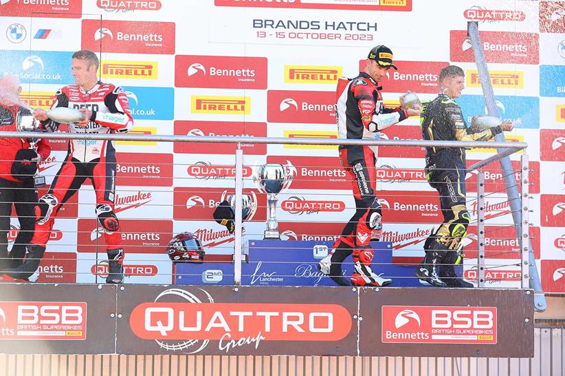 Glenn Irwin, Tommy Bridewell and Kyle Ryde celebrate on the Brands Hatch podium