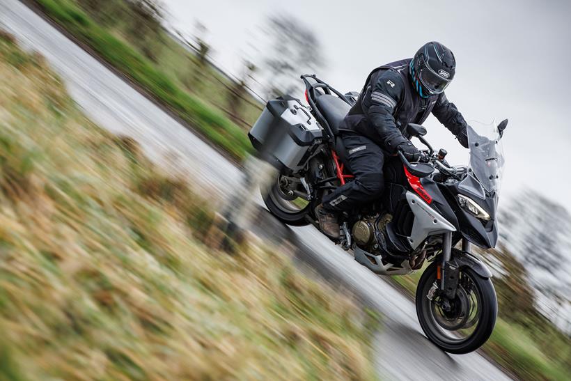 Ducati Multistrada V4 Rally cornering on a wet road