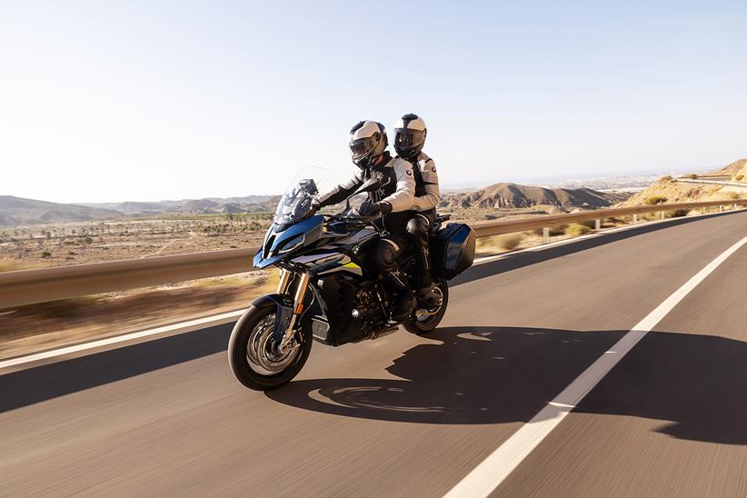 Rider and pillion on a 2024 BMW S1000XR