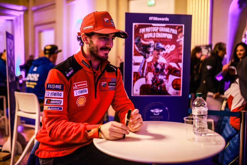 MotoGP world champion Pecco Bagnaia signing autographs