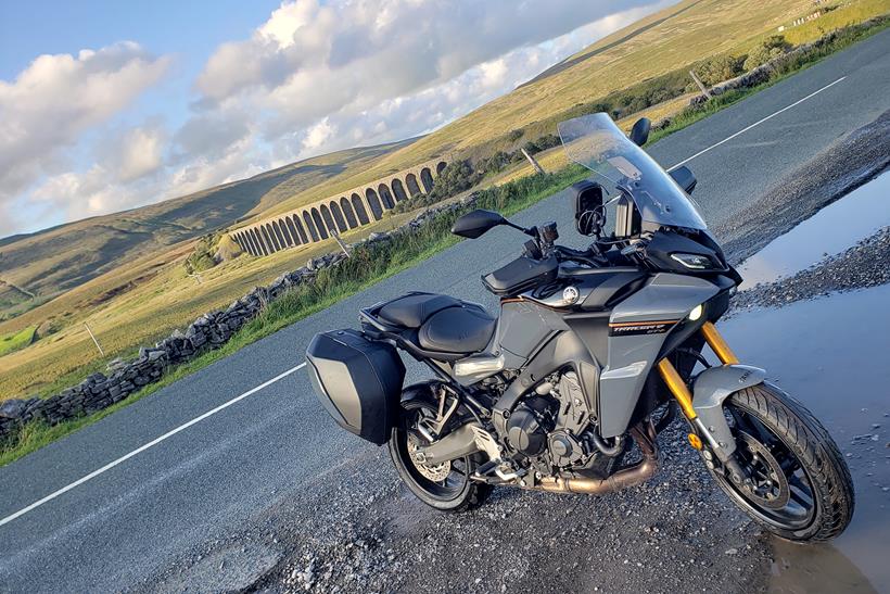 Yamaha Tracer 9 GT+ long-term test bike in front of viaduct