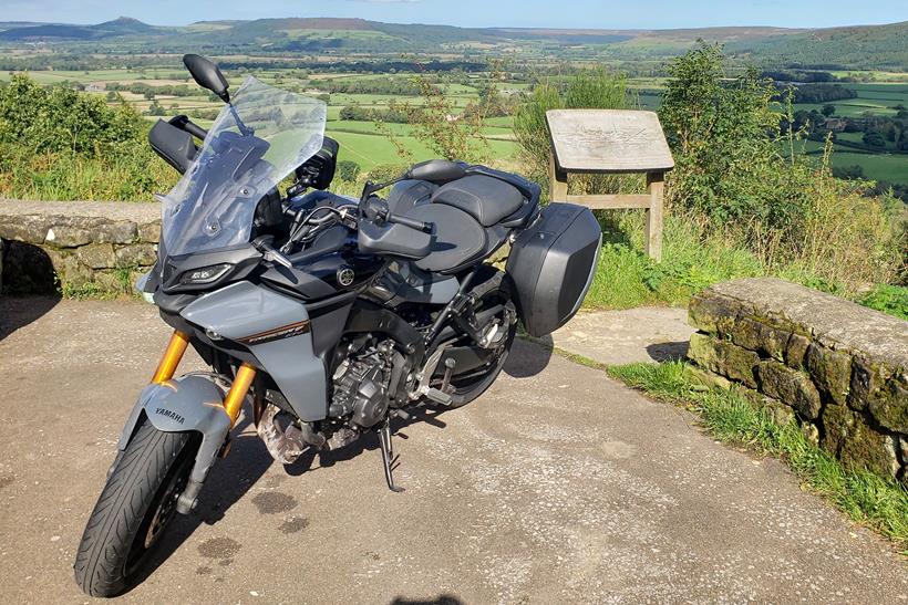 Yamaha Tracer 9 GT+ long-term test bike with scenic view