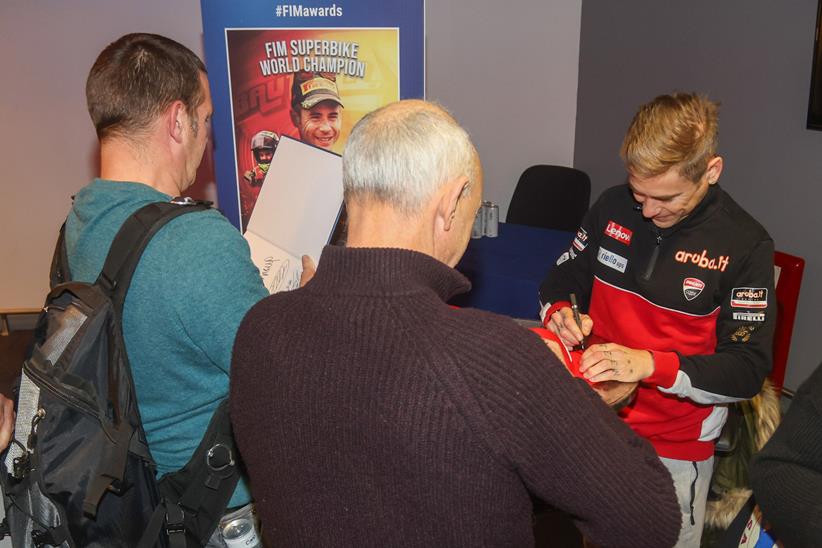 Alvaro Bautista signs autographs at the FIM awards