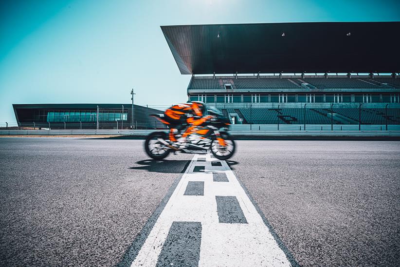 KTM RC 8C crossing the start/finish line on track