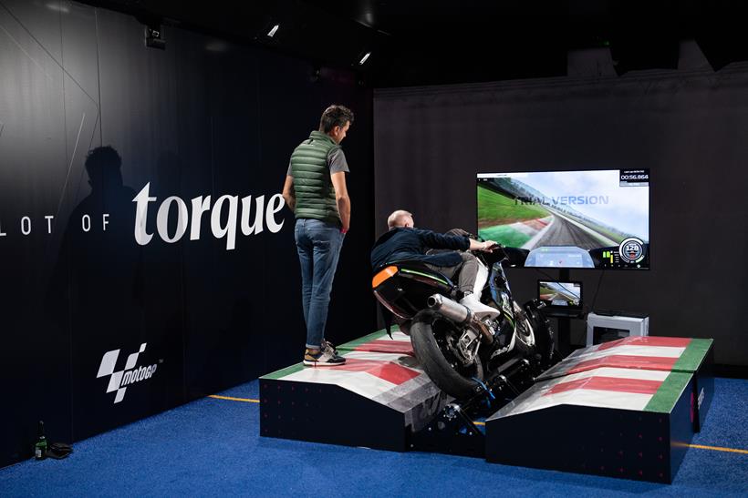 Photographed from behind of someone using moto trainer bike simulator