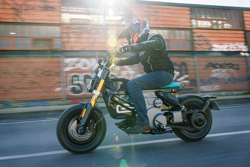 Riding a BMW CE 02 on a straight road