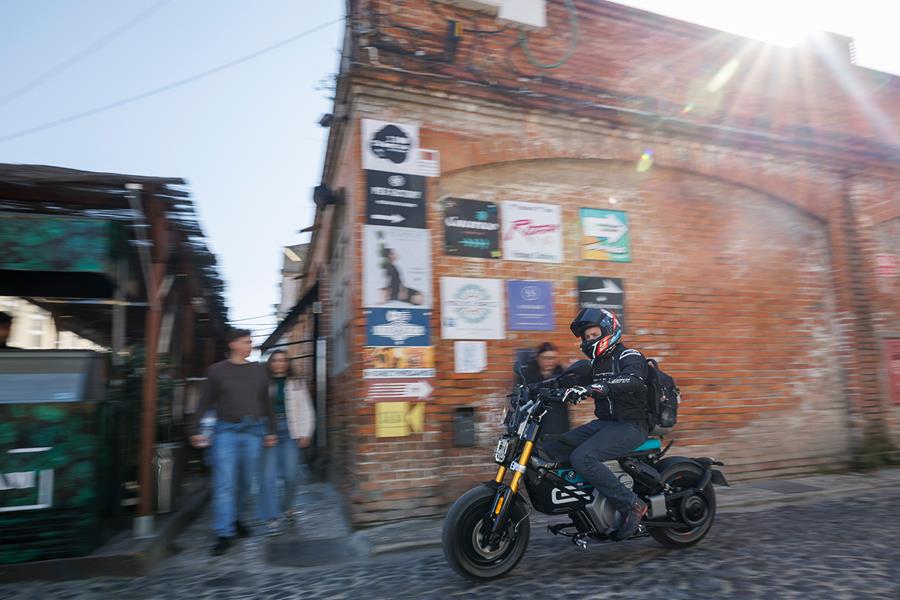 BMW CE 02 ridden in a town centre