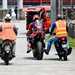Pedro Acosta is helped back to the paddock after a crash during the Sepang Test