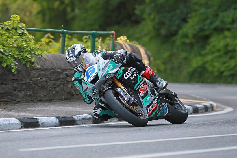 Michael Dunlop (MD Racing Yamaha) rounds Laurel Bank on his way to victory in the opening TT Supersport Race. Photo Rod Neill