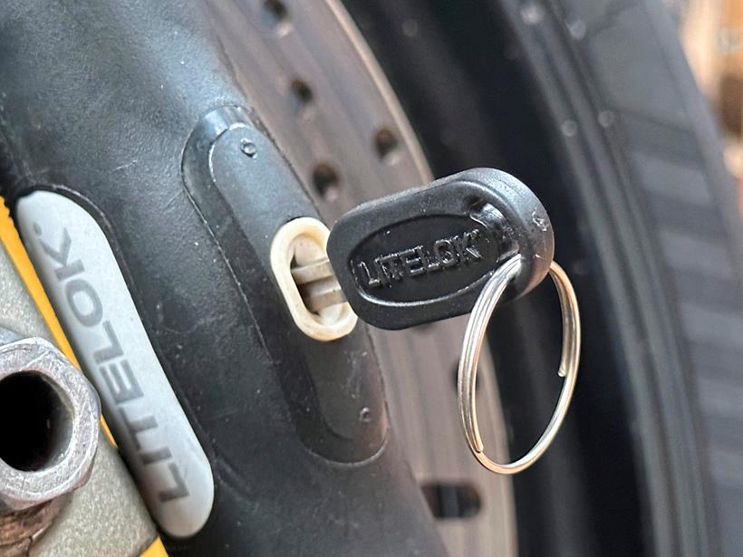 Close up of the Litelok X1 Moto lock and key