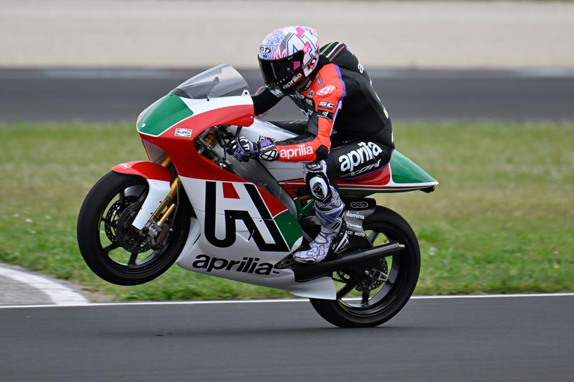 Aprilia all stars two stroke rider pulling wheelie on track