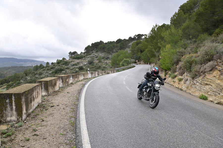 2024 Husqvarna Svartpilen 401 riding on a scenic mountain road