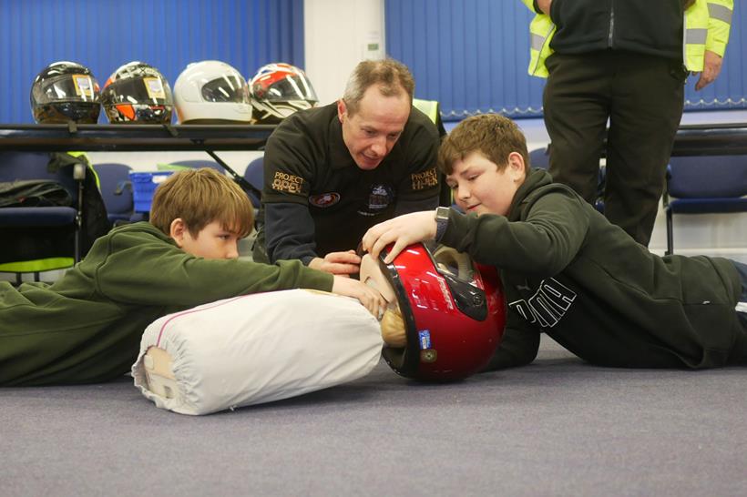 Youngsters learn safe helmet removal