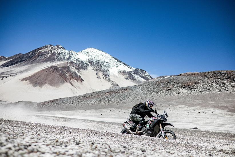 Pol Tarrés riding with snow capped mountain backdrop