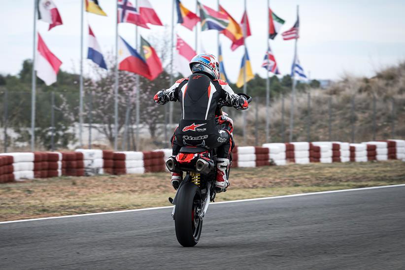 Pulling a wheelie on track on the Ducati Hypermotard 698 Mono