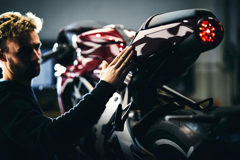 Technician checks over MV Agusta motorcycle