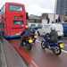 Motorcyclists behind bus in bus lane