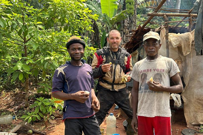 Derek with local men