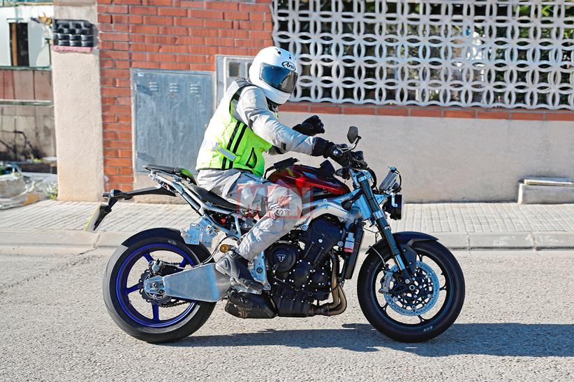 A Triumph Street Triple derived development bike being ridden